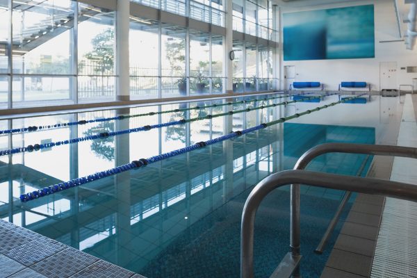 Empty swimming pool with large windows at the leisure center
